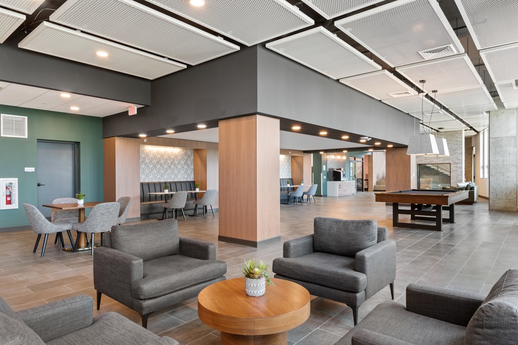 an open floor plan with a pool table in the center of the room
